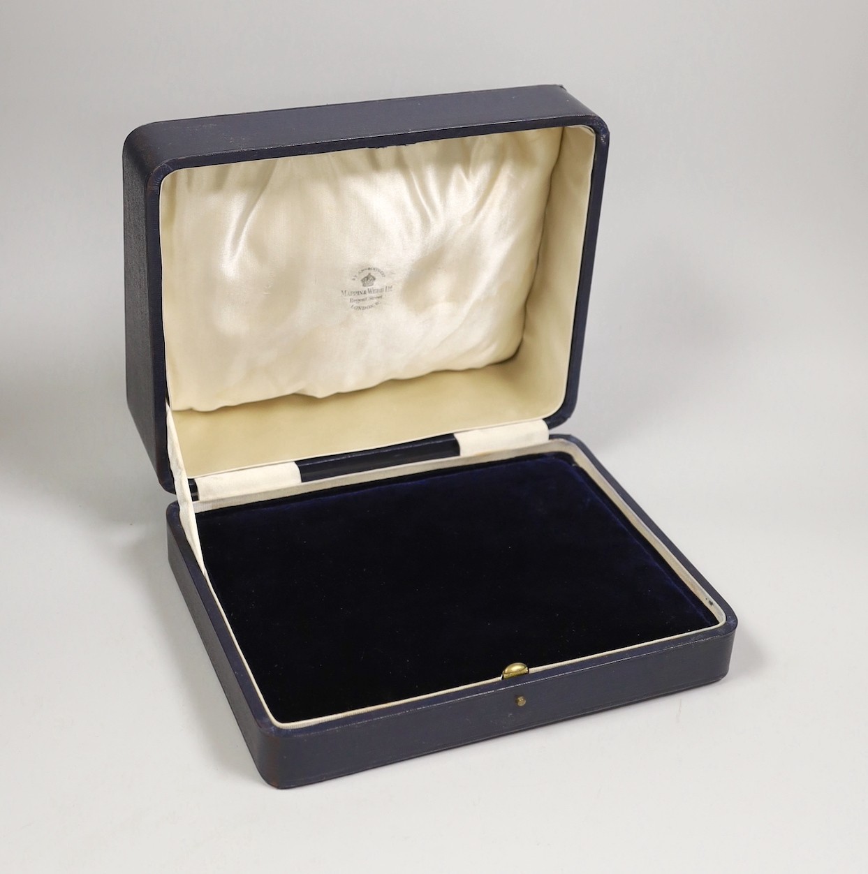 A Mappin & Webb leather display box, width 24cm.